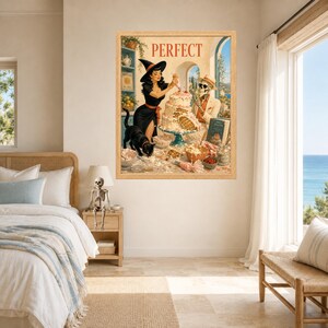 May include: A framed wall art print titled PERFECT featuring a woman in a black dress and witch hat decorating a multi-tiered cake alongside a skeleton in a suit. A black cat stands on the table near bowls, a book, and baking ingredients.