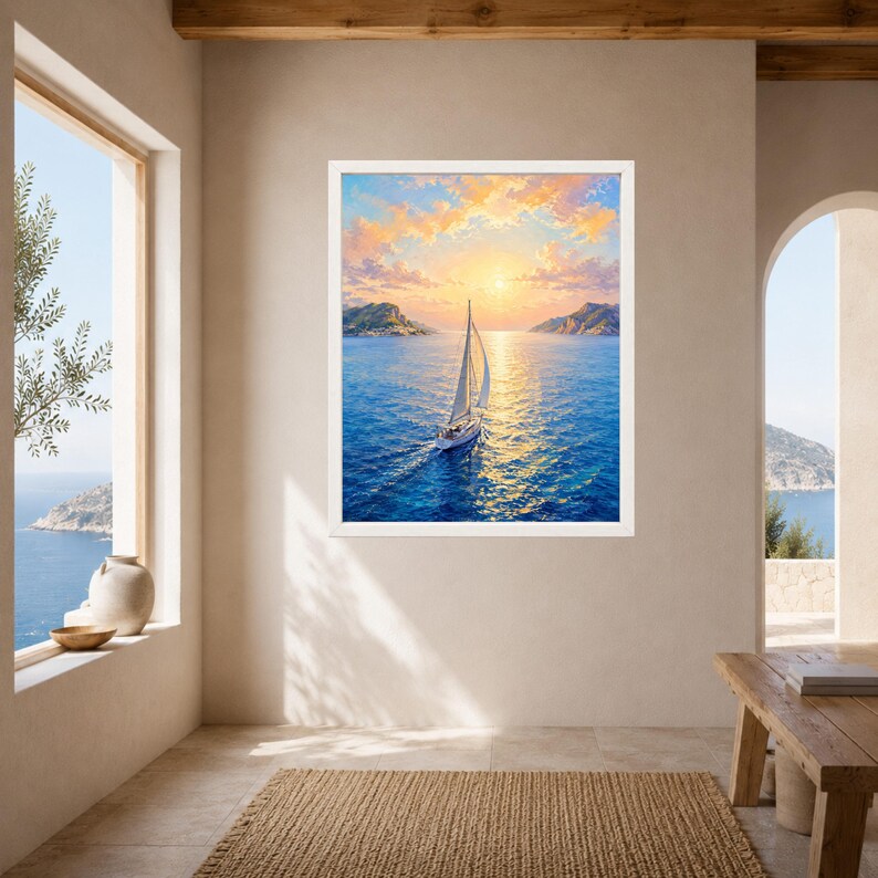 May include: A framed wall art print featuring a sailboat navigating calm blue waters during a golden sunset. The scene includes distant rocky cliffs under a sky filled with soft orange and yellow clouds, with sunlight reflecting on the sea surface.
