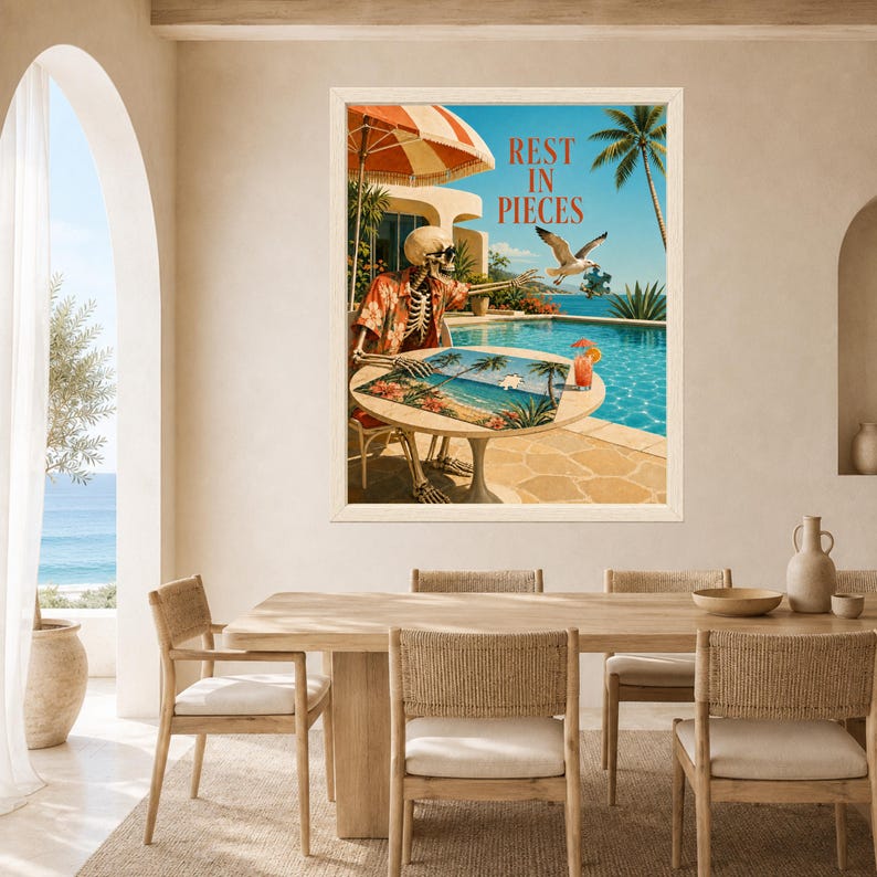 May include: A framed wall art print featuring a skeleton wearing a floral shirt sitting at a table by a swimming pool. The skeleton is working on a puzzle. A seagull flies nearby holding a puzzle piece. The text REST IN PIECES is at the top.
