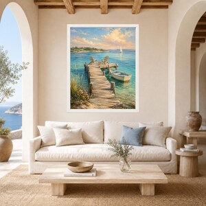 May include: A framed landscape painting depicting a wooden pier extending into calm turquoise water. Two chairs sit on the dock next to a small white rowboat. In the distance, a sailboat floats on the horizon under a soft, golden sunset sky.