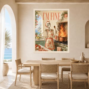 May include: A framed wall art print featuring a skeleton wearing a floral apron and headscarf, standing in a kitchen. The skeleton holds a wooden spoon near a stove with a large pot engulfed in flames. The text I'M FINE is printed at the top.