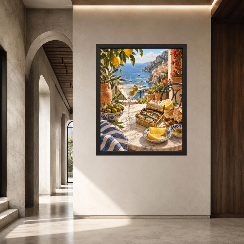 May include: A framed wall art print depicting a Mediterranean scene on a marble table. The image features a martini glass with olives, a tin of sardines, lemon wedges, a bowl of green olives, and a blue and white striped cloth, with a coastal view.