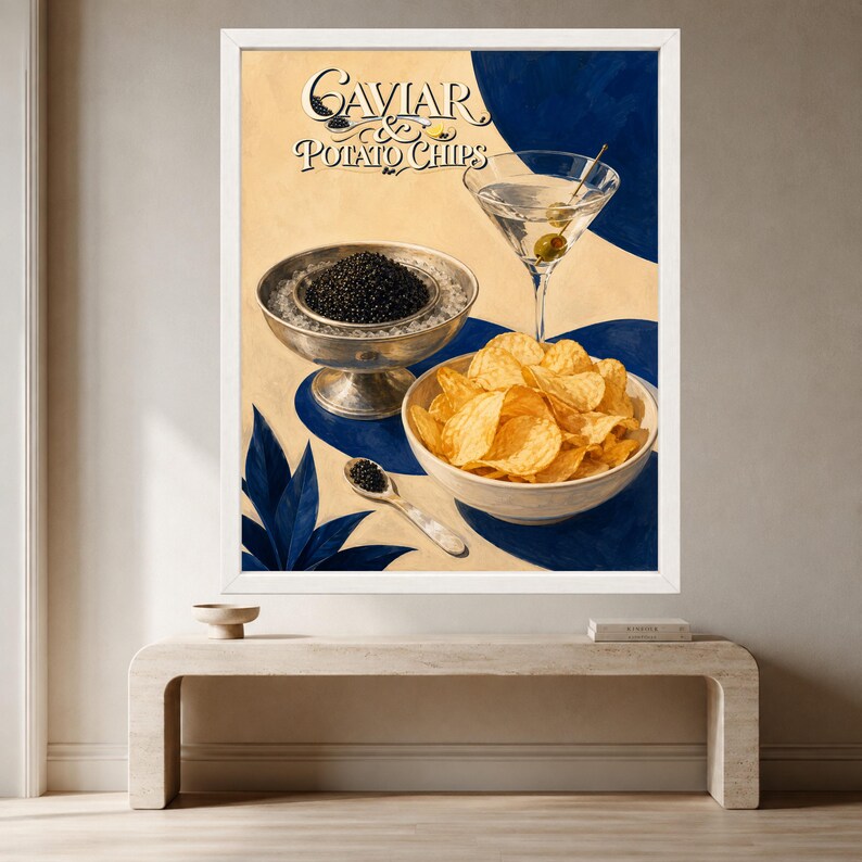 May include: A framed art print titled Caviar & Potato Chips featuring a silver bowl of black caviar, a white bowl of golden potato chips, a martini glass with an olive, and a small silver spoon, all set against a cream and blue background.
