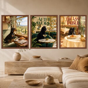 May include: Three framed wall art prints featuring animal scenes. The first shows a dachshund in a train window with the text WINDOW SEAT. The second shows a black cat in a bar with the text AFTER WORK. The third shows a black cat eating pasta with the text THE LAST TABLE.