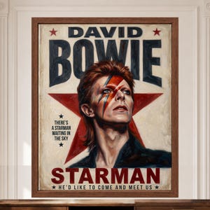 May include: A framed poster featuring a portrait of David Bowie with a red and blue lightning bolt across the face. The background displays a large red star and the text DAVID BOWIE, STARMAN, and the lyrics THERE'S A STARMAN WAITING IN THE SKY.