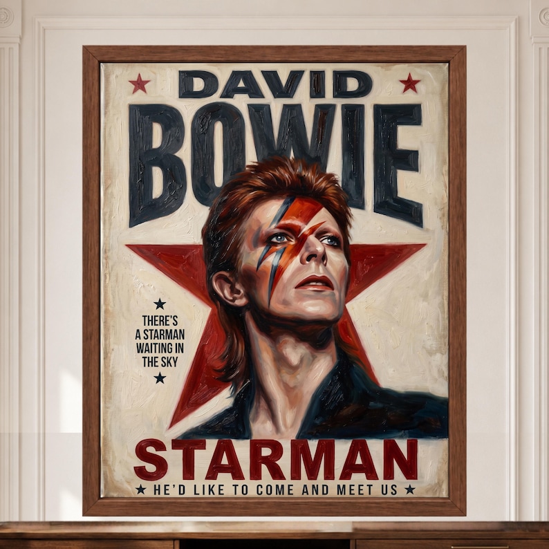 May include: A framed poster featuring a portrait of David Bowie with a red and blue lightning bolt across the face. The background displays a large red star and the text DAVID BOWIE, STARMAN, and the lyrics THERE'S A STARMAN WAITING IN THE SKY.