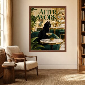 May include: A framed wall art print titled AFTER WORK featuring a black cat sitting on a dark green velvet chair at a small round marble table. On the table sits a cocktail glass and a small bowl of olives, with a bar background visible.