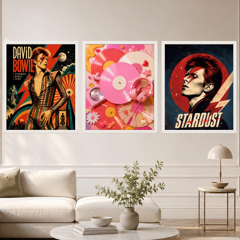 May include: Three framed wall art prints featuring David Bowie imagery. The left print shows Bowie in a striped suit with the text "DAVID BOWIE STARMAN REBEL ICON". The centre print displays pink vinyl records and headphones. The right print shows Bowie with a lightning bolt and the text "STARDUST".