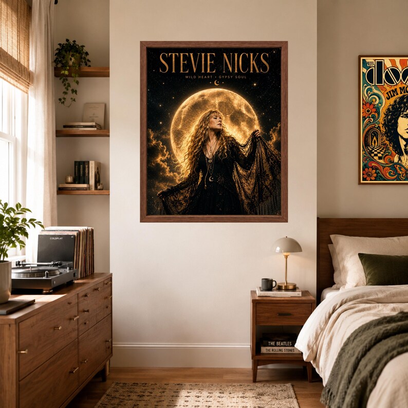 May include: A framed wall art print featuring a portrait of Stevie Nicks in a black lace outfit against a large, glowing full moon background. The text STEVIE NICKS and WILD HEART GYPSY SOUL is printed in gold at the top of the dark, celestial scene.