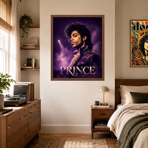 May include: A framed wall poster featuring a portrait of the musician Prince against a purple, smoky background with a spotlight. The artist is shown in profile wearing a purple jacket with a ruffled collar. The name PRINCE is printed in white.