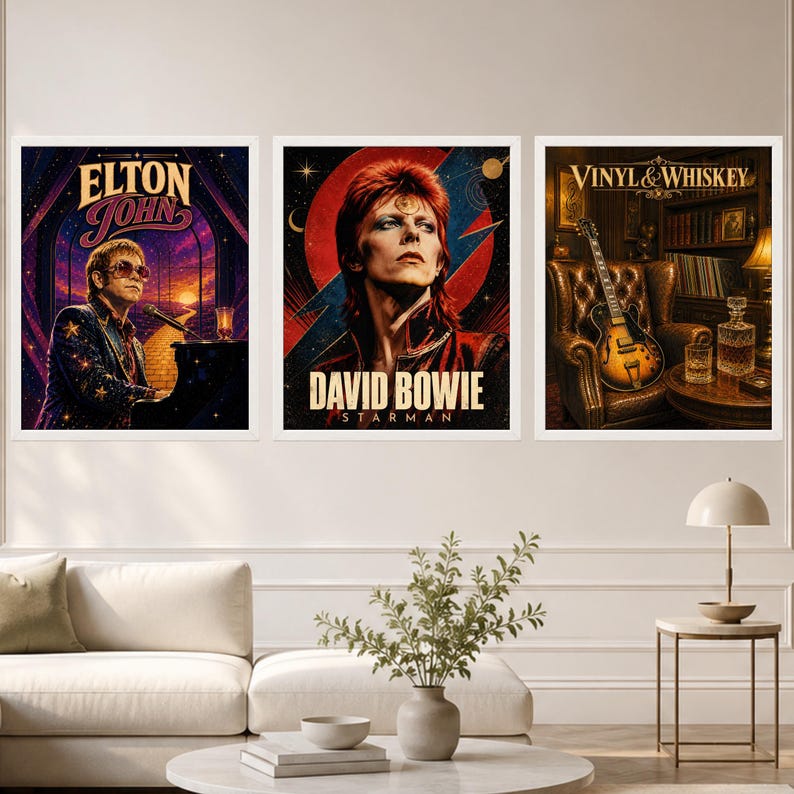 May include: Three framed wall art prints featuring musical themes. The left print shows Elton John at a piano, the center print depicts David Bowie with a red lightning bolt, and the right print displays a guitar, whiskey decanter, and the text Vinyl & Whiskey.