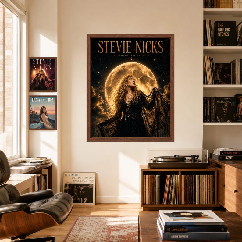 May include: A framed wall art print featuring a portrait of Stevie Nicks with long wavy hair, wearing a black lace garment against a large glowing full moon and starry night sky, with the text STEVIE NICKS WILD HEART GYPSY SOUL printed above.