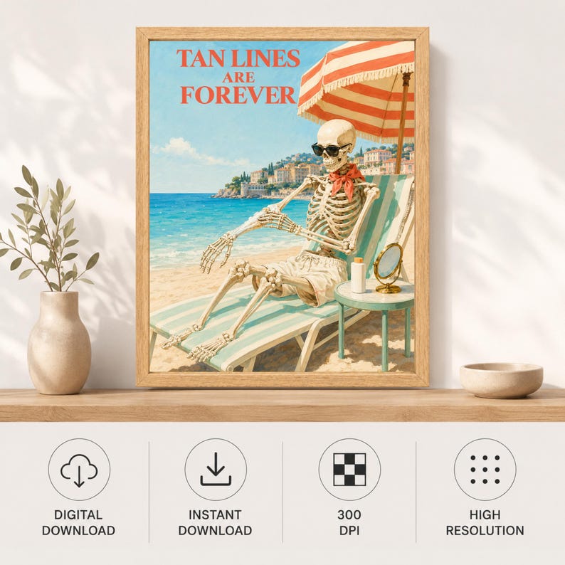 May include: A framed wall art print featuring a skeleton wearing sunglasses and a red neckerchief, lounging on a striped beach chair under a red and white umbrella. The text TAN LINES ARE FOREVER is printed in red at the top above a coastal scene.