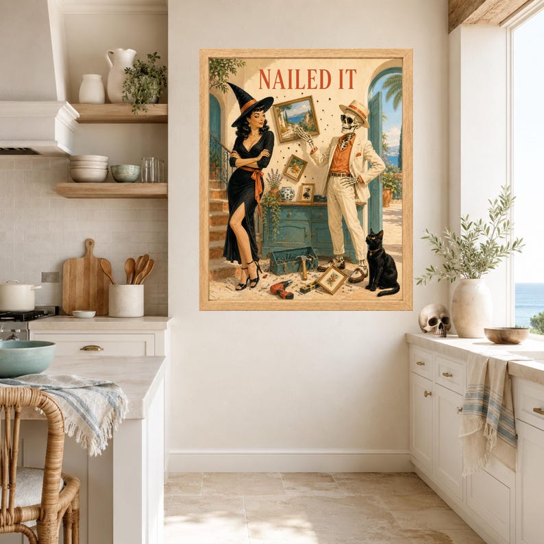 May include: A framed wall art print titled NAILED IT featuring a witch in a black dress and a skeleton in a beige suit standing in a room with tools, a toolbox, and a black cat. The scene depicts a home improvement theme with a Mediterranean backdrop.