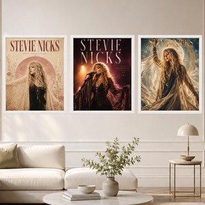 May include: A set of three framed wall art prints featuring Stevie Nicks. The left print shows her with a moon and floral motifs. The centre print depicts her performing on stage with a microphone. The right print shows her in a flowing garment.