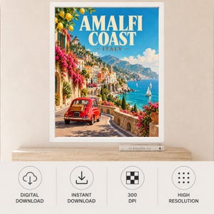 May include: A framed travel poster featuring the Amalfi Coast in Italy. The scene shows a red vintage car on a coastal road, vibrant pink bougainvillea, yellow lemons, and sailboats on the blue sea. The text reads AMALFI COAST ITALY.