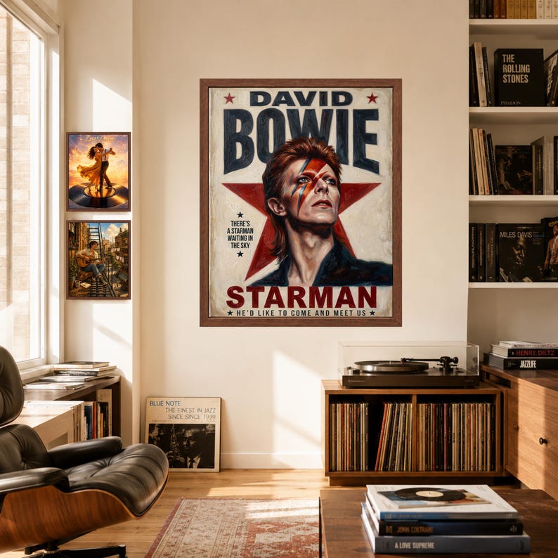 May include: A framed poster featuring a portrait of David Bowie with a red lightning bolt across his face, set against a large red star. The text reads DAVID BOWIE, STARMAN, and includes the lyrics THERE'S A STARMAN WAITING IN THE SKY and HE'D LIKE TO COME AND MEET US.