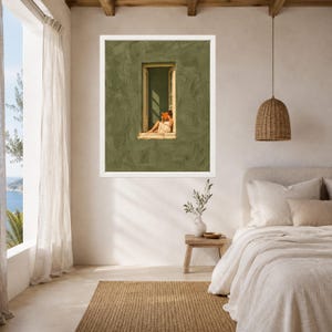 May include: A framed wall art print featuring a textured olive green wall with a central window. A figure sits in the window frame reading an orange book. The artwork is displayed in a white frame on a neutral-toned bedroom wall above a wooden side table.