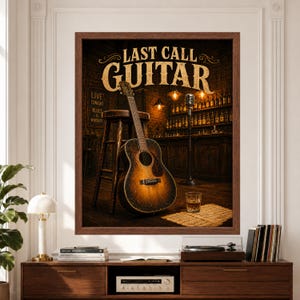 Framed Last Call Guitar wall art featuring a worn acoustic guitar beside a wooden bar stool and vintage microphone in a warm blues bar with dark wood shelves, amber lights, drink glass and scattered sheet music above a record player console.