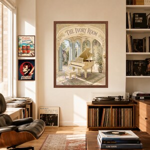 May include: A framed wall art print titled The Ivory Room featuring a grand piano in an ornate, sunlit architectural space with arched doorways and greenery. The artwork is displayed on a wall alongside two smaller framed music-themed posters.