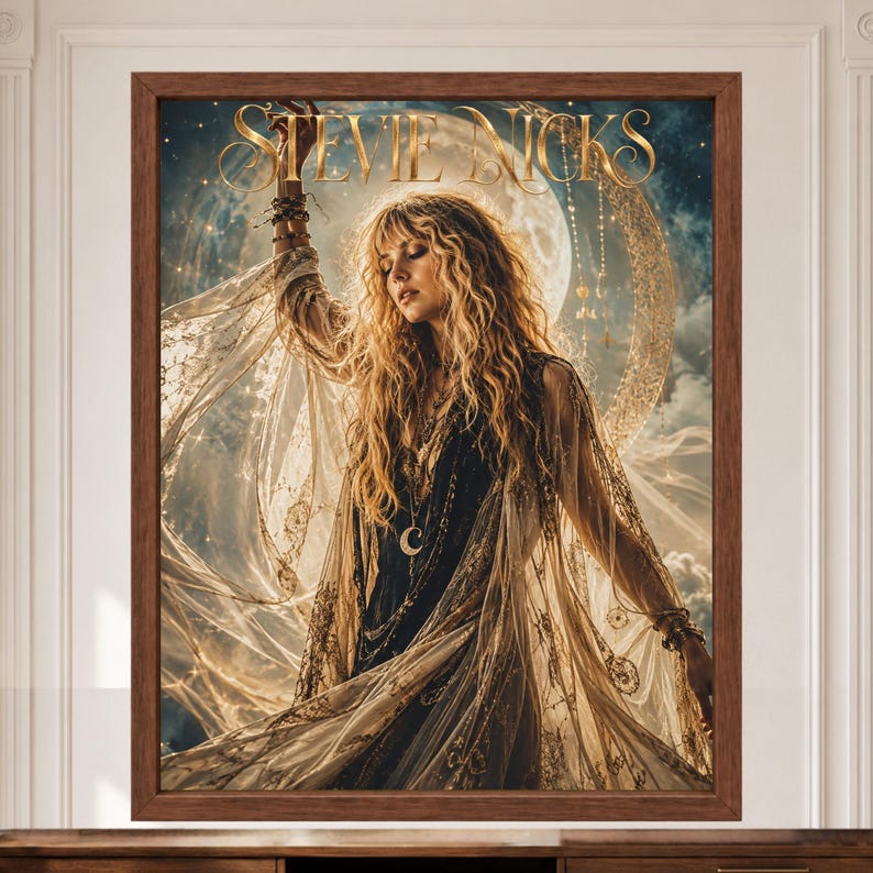 May include: A framed wall art print featuring a portrait of Stevie Nicks with long blonde hair, wearing a dark dress and a sheer, flowing gold-toned lace shawl. The background displays a large glowing moon, stars, and hanging jewelry elements.