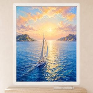 May include: A framed wall art print depicting a sailboat navigating deep blue waters during a golden sunset. The scene features a bright sun low on the horizon, soft orange and yellow clouds, and distant rocky coastlines on both sides of the sea.