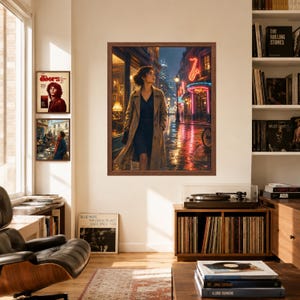May include: A framed wall art print depicting a person in a tan trench coat walking down a rain-slicked city street at night, illuminated by neon signs including a glowing red saxophone, with two smaller framed prints displayed on the wall nearby.