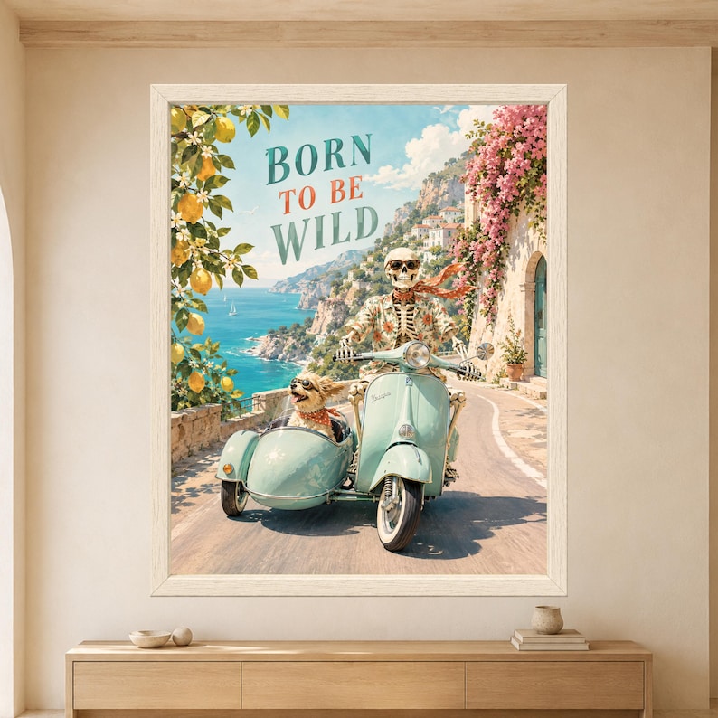Framed Born to Be Wild skeleton wall art featuring a sunglasses-wearing skeleton riding a mint green vintage scooter with a dog in the sidecar along a sunny Mediterranean coastal road.