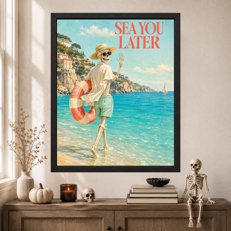May include: A framed wall art print featuring a skeleton wearing a straw hat, sunglasses, a white shirt, and green shorts, holding a red and white striped life preserver while walking into the ocean. The text SEA YOU LATER is printed in red.