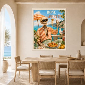 Peut inclure: Une impression d'art encadr&eacute;e repr&eacute;sentant un squelette portant des lunettes de soleil et une chemise ray&eacute;e orange et blanche, assis &agrave; une table au bord de la mer. Le squelette tient une fourchette avec des p&acirc;tes, et le texte BONE APPETIT est inscrit.