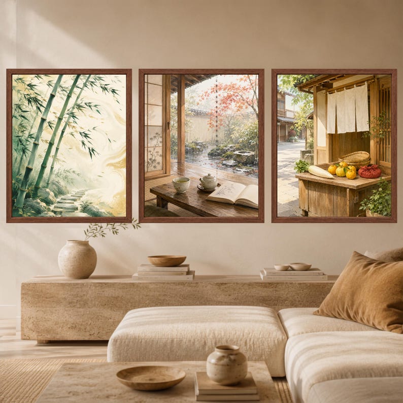 May include: A set of three framed wall art prints featuring Japanese-inspired scenes. The left print shows a bamboo forest path, the center depicts a wooden porch with a tea set and book, and the right shows a market stall with produce.