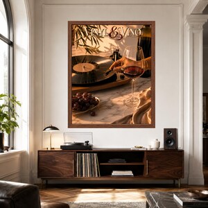 May include: A framed wall art print titled Vinyl & Vino featuring a black vinyl record on a turntable, a glass of red wine, and a bowl of grapes on a marble surface. The warm lighting highlights the scene, creating a cosy atmosphere.