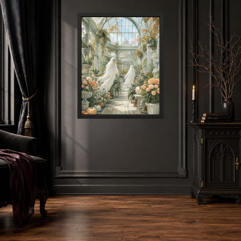 May include: A framed wall art print depicting a glass conservatory filled with lush greenery, blooming orange and white flowers, and pumpkins, featuring two translucent white ghost figures floating along a central stone pathway under a glass roof.