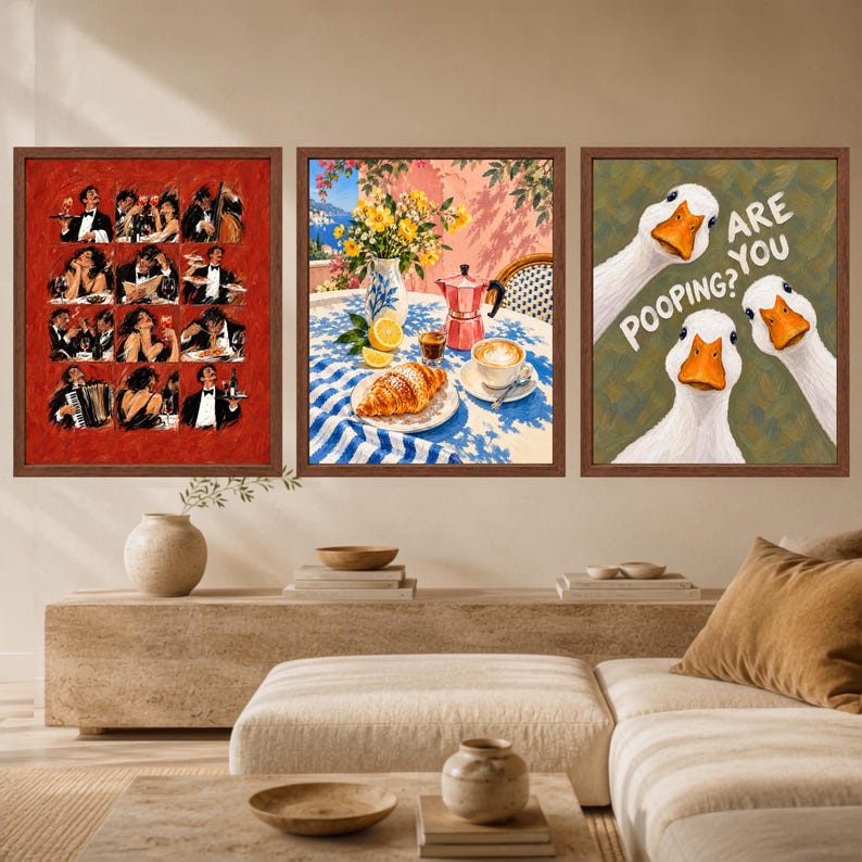 May include: A set of three framed wall art prints. The left print features a red grid of twelve illustrations of people dining. The center print shows a Mediterranean breakfast scene with a croissant, coffee, and flowers. The right print depicts three white geese with the text "ARE YOU POOPING?"