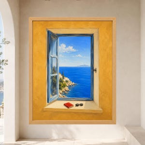 May include: A framed painting depicting an open window with a blue frame set in a textured yellow wall. The view through the window shows a bright blue sea, a rocky coastline with trees, and a clear sky. A red book and black sunglasses sit on the sill.