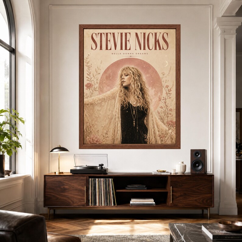 May include: A framed wall art print featuring a portrait of Stevie Nicks with the text "STEVIE NICKS" and "BELLA DONNA DREAMS" at the top. The image shows a person with long blonde hair wearing a black top and a lace shawl, set against a large pink moon.
