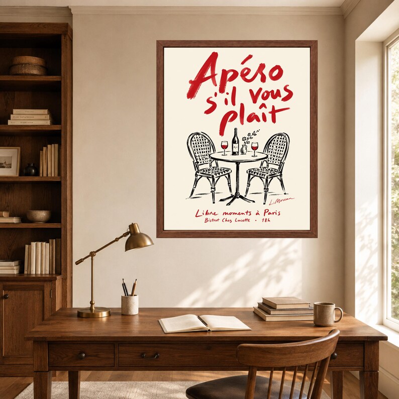May include: A framed wall art print featuring a black and white line drawing of two bistro chairs and a small round table with a wine bottle and two glasses. The text reads Ap&eacute;ro s'il vous pla&icirc;t, Libre moments &agrave; Paris, and Bistrot Chez Lucette.