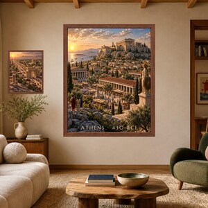 May include: Two framed wall art prints featuring historical cityscapes. The larger print depicts Athens in 430 BCE with the Parthenon and a statue, while the smaller print shows Palmyra. Both prints are enclosed in brown wooden frames.