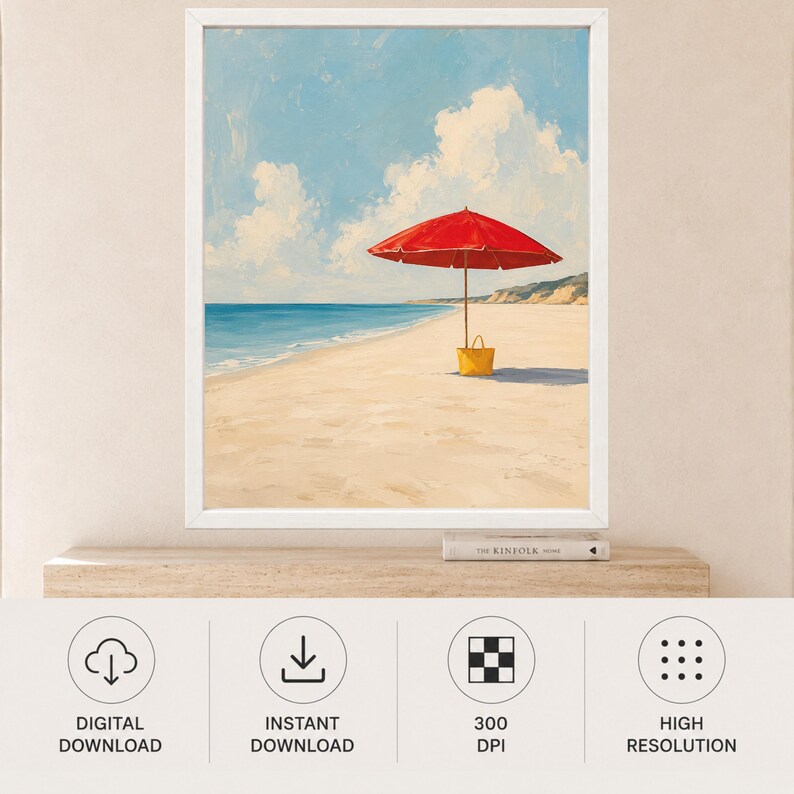 May include: A framed painting of a sandy beach scene under a bright blue sky with white clouds. A vibrant red beach umbrella stands in the sand, casting a shadow, with a yellow tote bag placed at the base of the pole near the calm blue ocean.