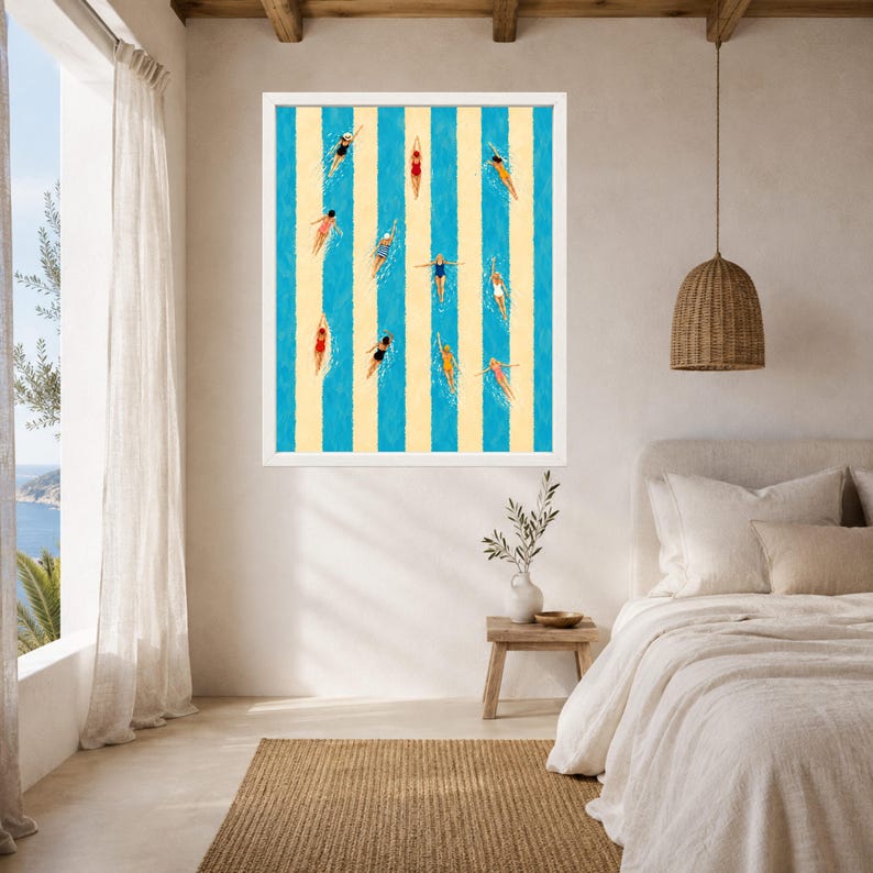 May include: A framed wall art print featuring a top-down view of swimmers in a pool with alternating vertical stripes of bright blue and pale yellow. The swimmers are depicted in various colorful swimsuits, performing different swimming strokes.