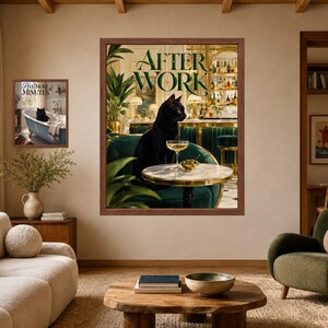 May include: Two framed wall art prints. The larger print features a black cat sitting on a green velvet chair at a marble table with a cocktail, under the text AFTER WORK. The smaller print shows a black cat in a bathtub with the text FIVE MORE MINUTES.