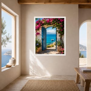 May include: A framed wall art print depicting an open blue door set in a white stone archway, framed by vibrant pink bougainvillea flowers. The view through the doorway reveals a bright blue sea with a small white boat under a clear sky.