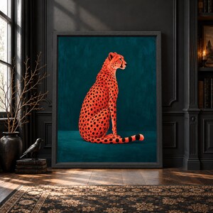 Framed cheetah wall art featuring a seated orange-red spotted cheetah with a long striped tail against a rich dark teal background in a bold contemporary animal portrait.