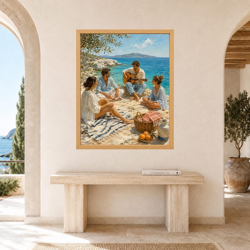 May include: A framed oil painting depicting three people sitting on a rocky Mediterranean coastline. One person plays an acoustic guitar while others relax on a striped blanket near a woven picnic basket, oranges, and a ceramic jug by the blue sea.