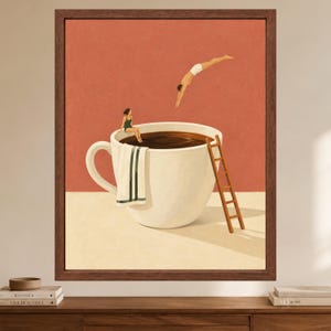 May include: A framed wall art print featuring a large white coffee cup filled with dark liquid against a terracotta background. A person in a green swimsuit sits on the rim with a towel, while another person dives into the coffee from above.
