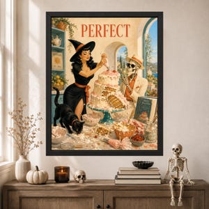 May include: A framed wall art print titled PERFECT featuring a black-haired witch in a black dress decorating a multi-tiered cake. A black cat stands nearby, while a skeleton wearing a hat and sunglasses watches. The scene includes baking tools.
