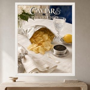 May include: A framed wall art print titled Caviar & Potato Chips featuring a silver foil bag of golden potato chips, a small silver tin of black caviar, a crystal glass of water, a lemon, a white napkin with a shell ring, and white flowers.