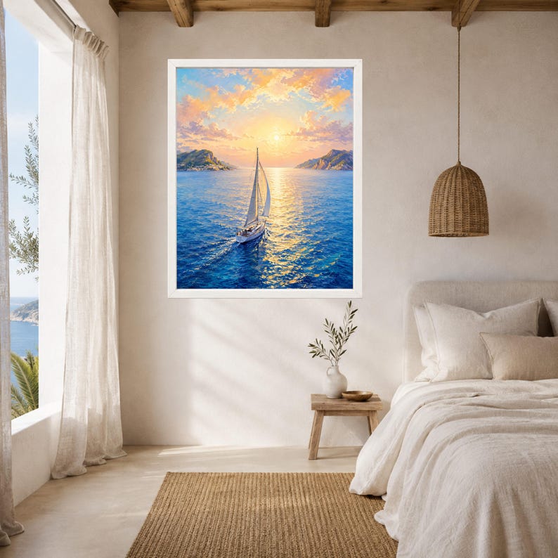 May include: A framed wall art print depicting a white sailboat navigating deep blue ocean waters under a vibrant sunset sky with golden clouds. The scene features distant coastal hills on the horizon, with the sun casting a bright reflection.