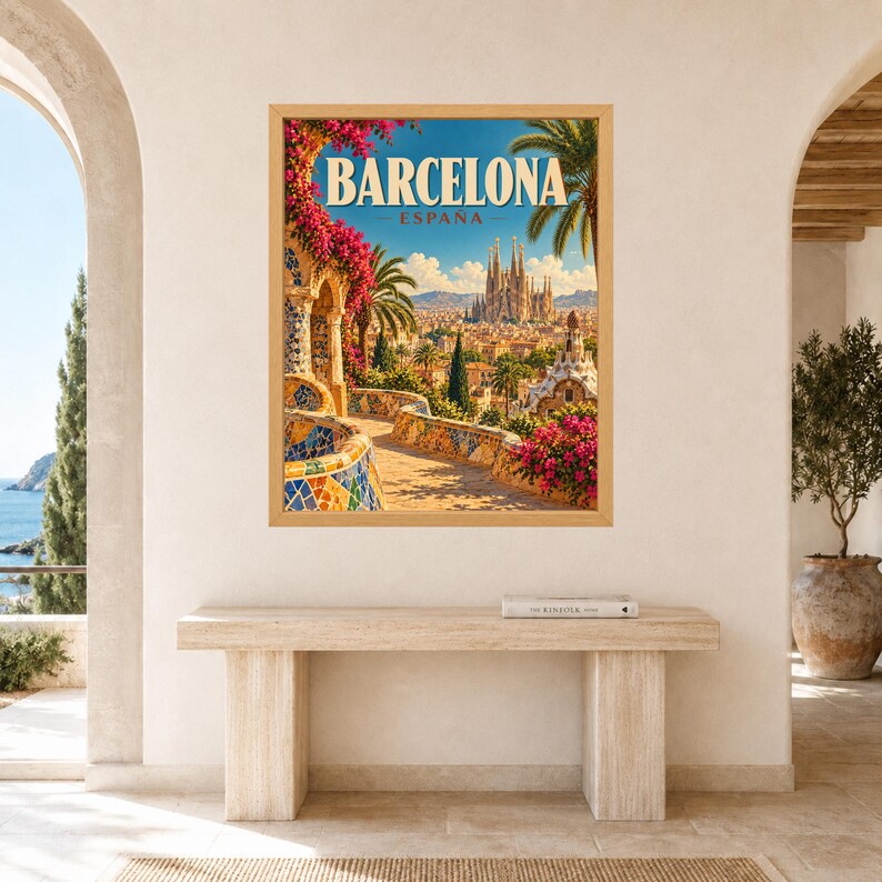 May include: A framed travel poster featuring a vibrant illustration of Barcelona, Spain. The artwork displays a sunlit stone walkway with colorful mosaic tiles, bright pink bougainvillea flowers, palm trees, and the Sagrada Familia in the distance.