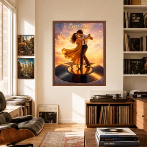 May include: A framed wall art print titled Last Dance featuring a couple dancing on a large black vinyl record against a sunset sky with musical notes. The artwork is displayed in a room with other framed prints and a record player nearby.